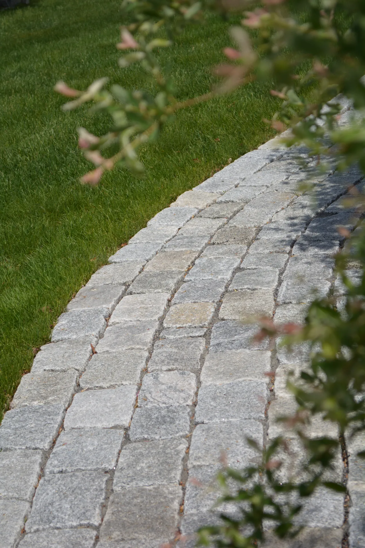 Natural stone pathway leading to a home
