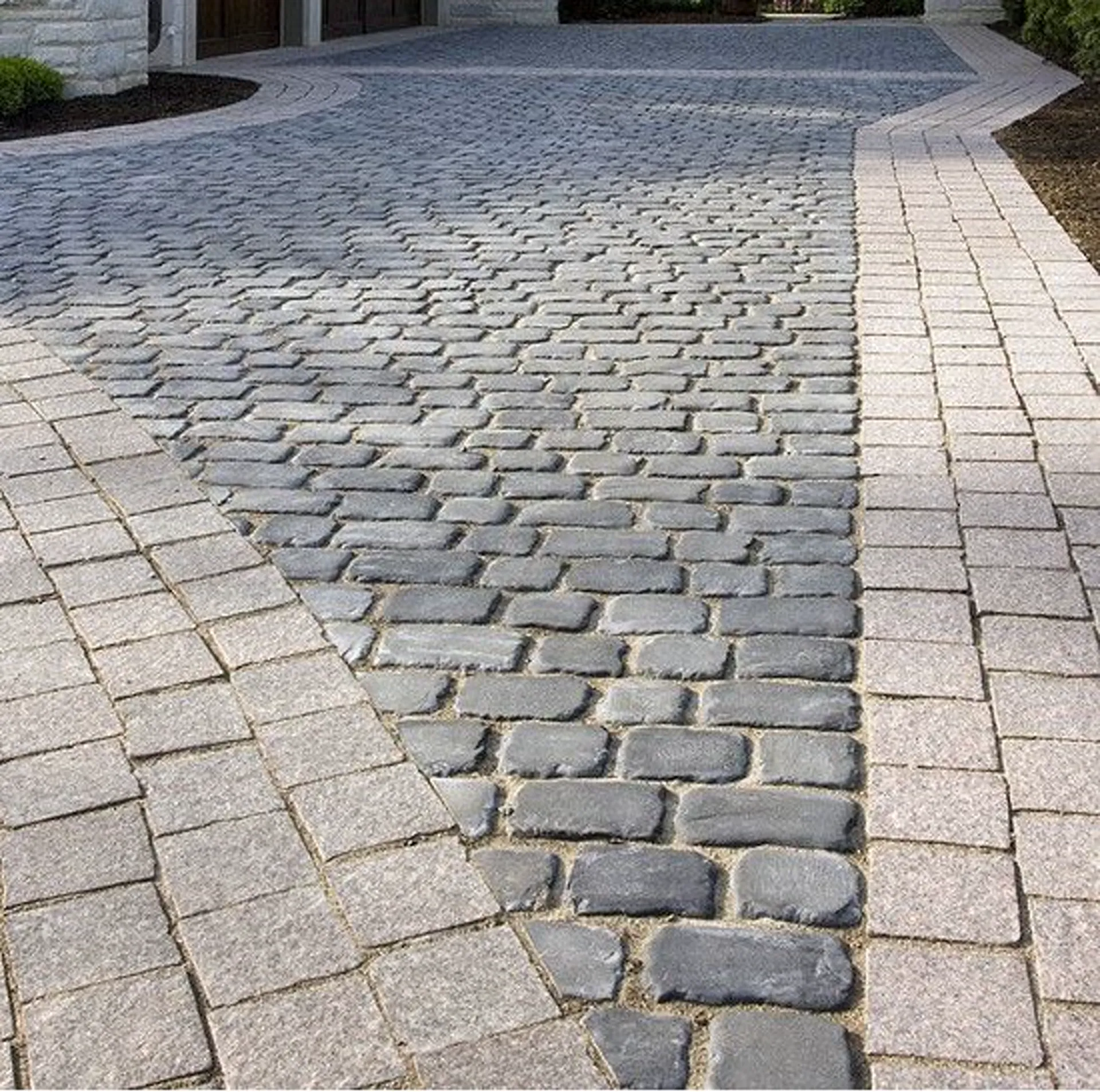 Cobblestone driveway and pathway installation